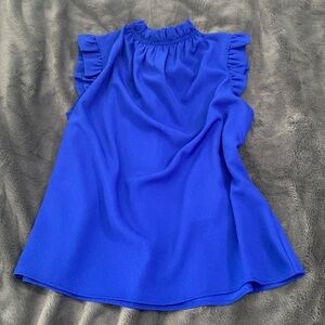 Royal blue blouse with pearl button closure